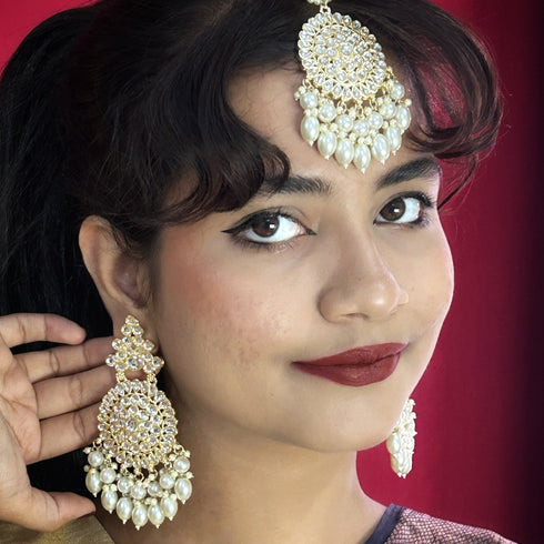 High Gold Kundan Pearl Earrings & Maang Tikka Set from Trenzify Store.