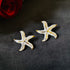Star Bloom anti-tarnish enamel stud earrings in white with high gold plating on stainless steel from Trenzify Store