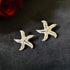 Star Bloom anti-tarnish enamel stud earrings in white with high gold plating on stainless steel from Trenzify Store