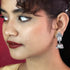 Traditional Silver Jhumka Earrings with Colored Stones & Pearl Drops from Trenzify Store.