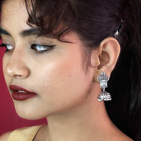 Traditional Silver Jhumka Earrings with Colored Stones & Pearl Drops from Trenzify Store.