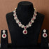 Elegant ruby red stone necklace set with matching drop earrings, featuring teardrop design, white CZ embellishments, and gold-plated finish – perfect for weddings and festive occasions.
