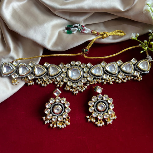 Model wearing black rhodium and gold plated Kundan choker necklace set with matching earrings – imitation jewelry from Trenzify Store.