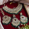 Traditional Kundan bridal necklace set with green bead detailing, gold plating, and matching chandbali earrings and Maang Tikka from Trenzify Store.