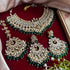 Traditional Kundan bridal necklace set with green bead detailing, gold plating, and matching chandbali earrings and Maang Tikka from Trenzify Store.