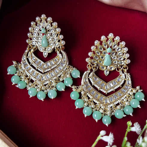 Kundan Peacock Chandbali Earrings from Trenzify Store.
