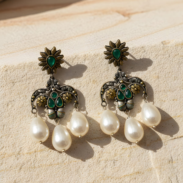 Oxidized floral pearl drop earrings with green stones, antique silver finish and triple pearl hanging from Trenzify Store