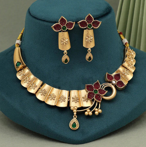 Gold choker necklace set with red stones, matching earrings and bracelet – imitation jewelry from Trenzify Store.