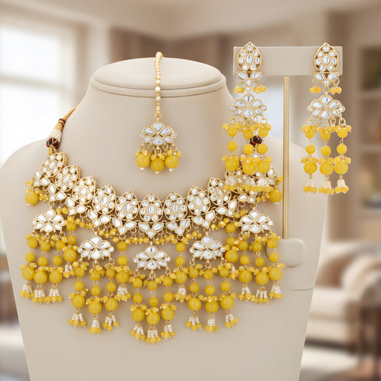 Yellow Kundan Necklace, Earrings & Maang Tikka Set from Trenzify Store.
